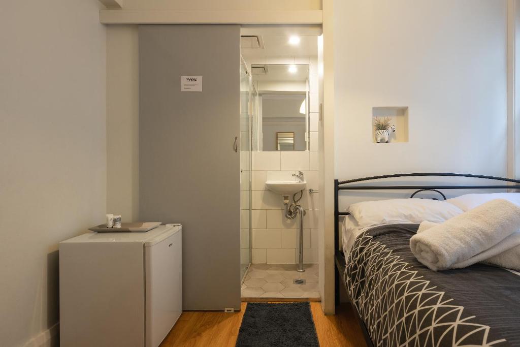 Postel nebo postele na pokoji v ubytování Highfield Private Hotel
