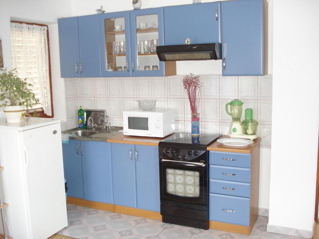 Kuchyň nebo kuchyňský kout v ubytování Apartment Goran