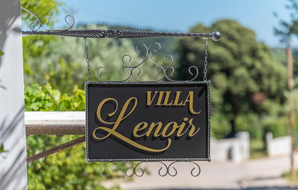 a black sign that reads willka favor at Villa Lenoir in Vrsar