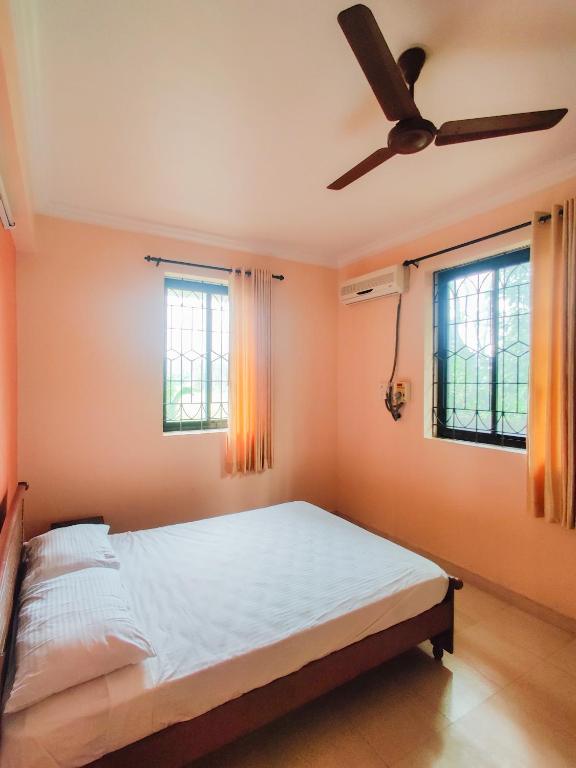 Postel nebo postele na pokoji v ubytování Hotel Siesta De Goa
