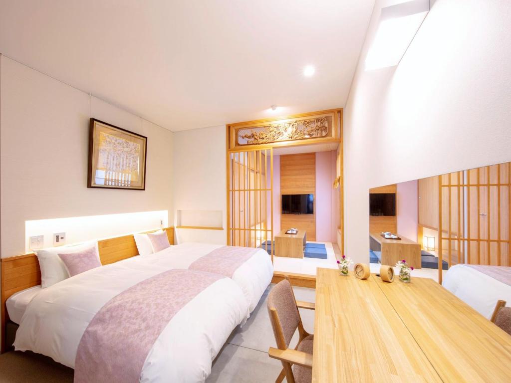 Letto o letti in una camera di Tanakaya Kyoto Karasuma