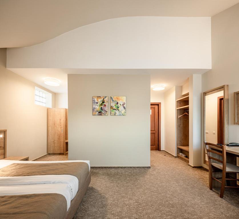 Postel nebo postele na pokoji v ubytování Hotel Kolping