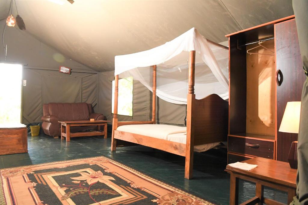 Postel nebo postele na pokoji v ubytování Mara Duma Bush Camp