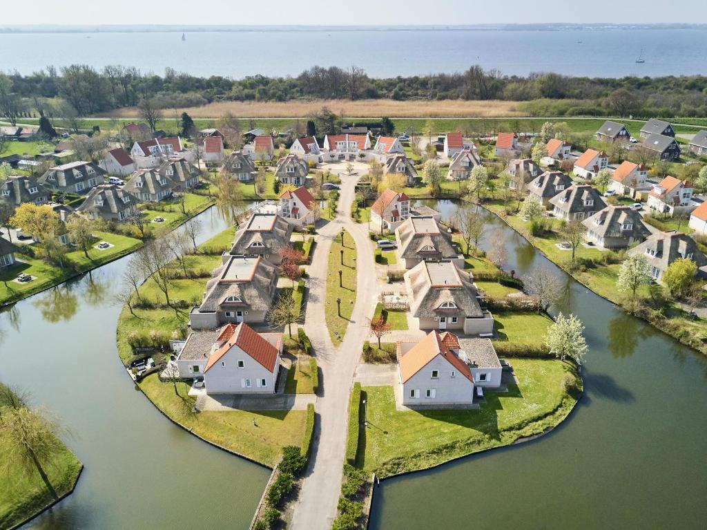 an aerial view of a village next to a river at Resort Citta Romana in Hellevoetsluis