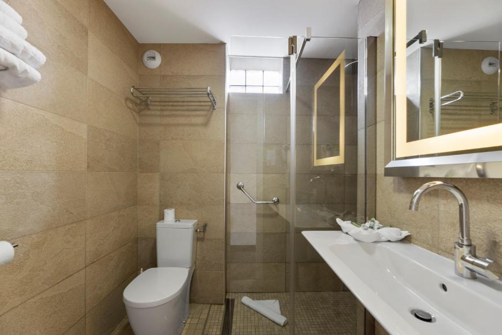 a bathroom with a toilet and a sink at Napoleon in Ajaccio