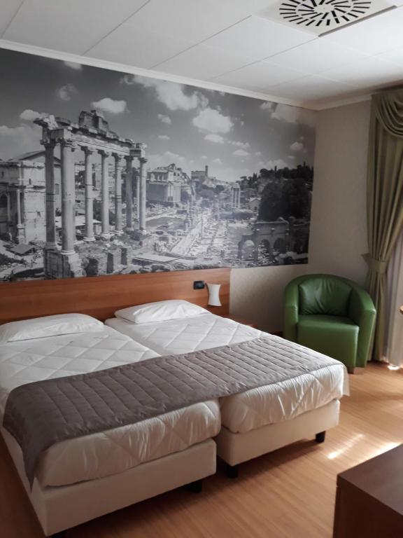 Postel nebo postele na pokoji v ubytování Ele Green Park Hotel Pamphili