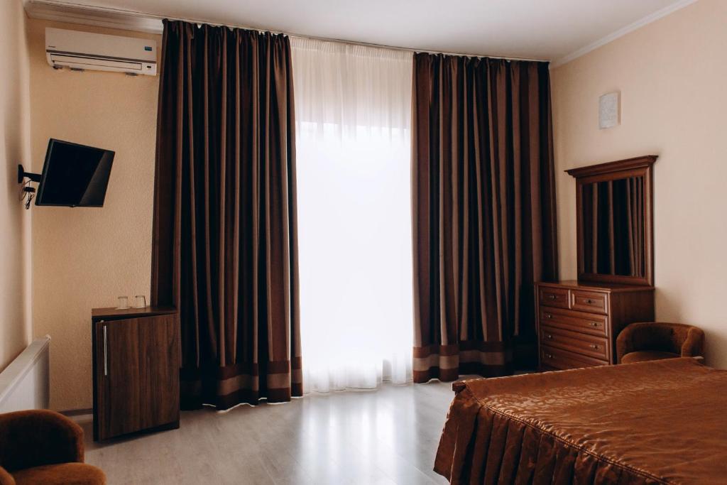 TV a/nebo společenská místnost v ubytování Hotel DA NONNA