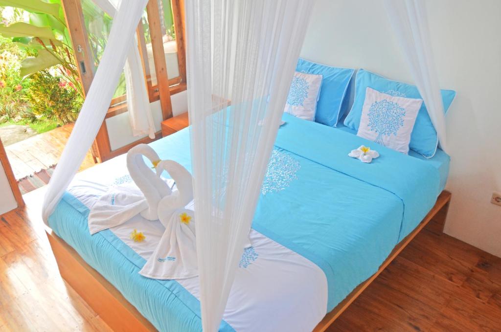 Postel nebo postele na pokoji v ubytování Lagoona Beach Bungalows - Eco Stay