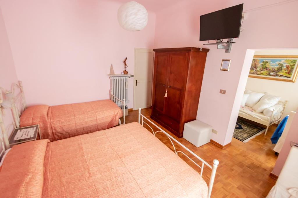 Łóżko lub łóżka w pokoju w obiekcie B&B Le Campane