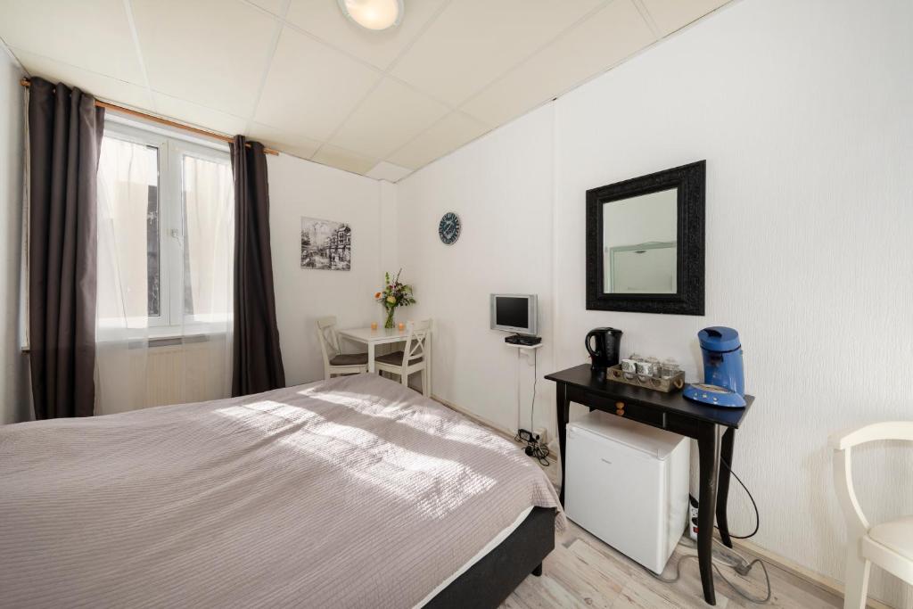 Postel nebo postele na pokoji v ubytování Blankebil Rooms