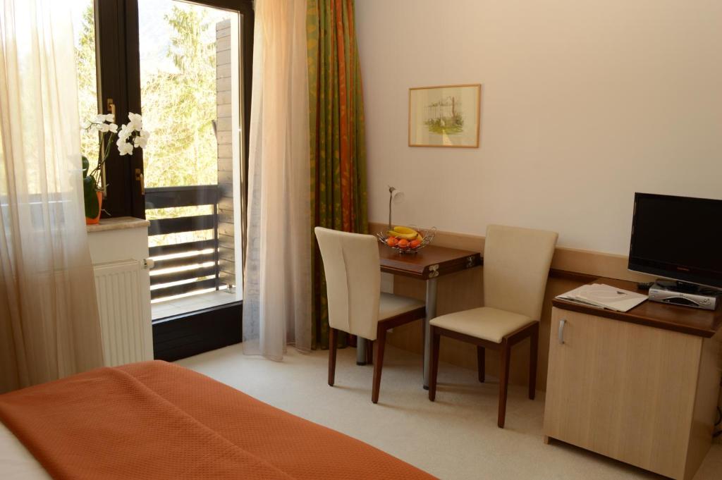 TV a/nebo společenská místnost v ubytování Vila Park B&B - Adults Only
