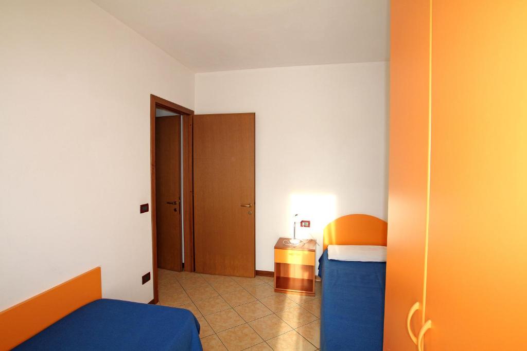 Postel nebo postele na pokoji v ubytování Olmi Lido Altanea