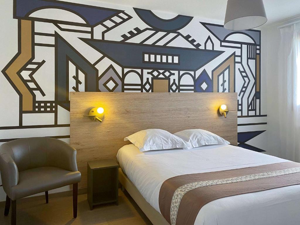 מיטה או מיטות בחדר ב-Aparthotel Adagio Bâle Mulhouse Aeroport