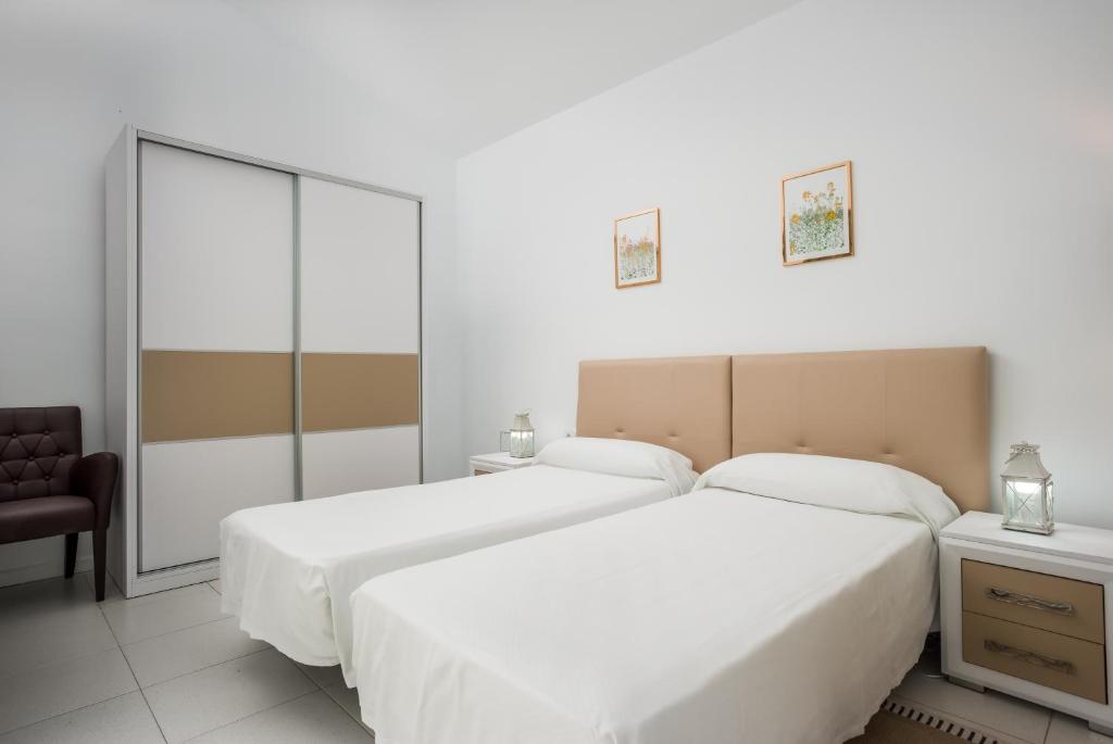 Postel nebo postele na pokoji v ubytování Haciendas IV
