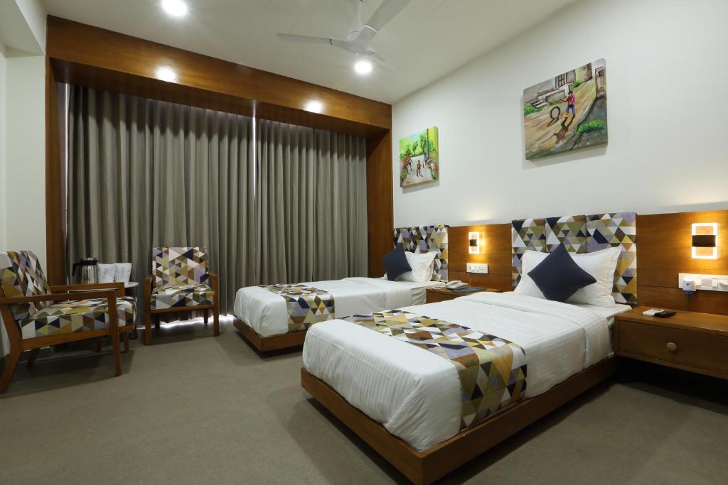 Postel nebo postele na pokoji v ubytování HOTEL FLOURISH INTERNATIONAL