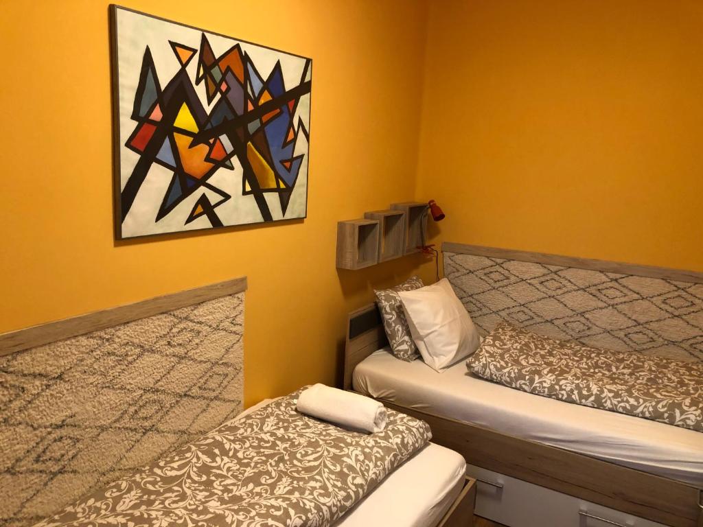 Postel nebo postele na pokoji v ubytování Galéria deluxe apartman