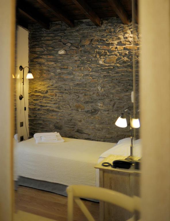 Postel nebo postele na pokoji v ubytování Marelia Hotel