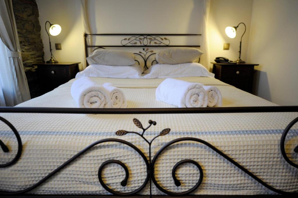 Postel nebo postele na pokoji v ubytování Marelia Hotel