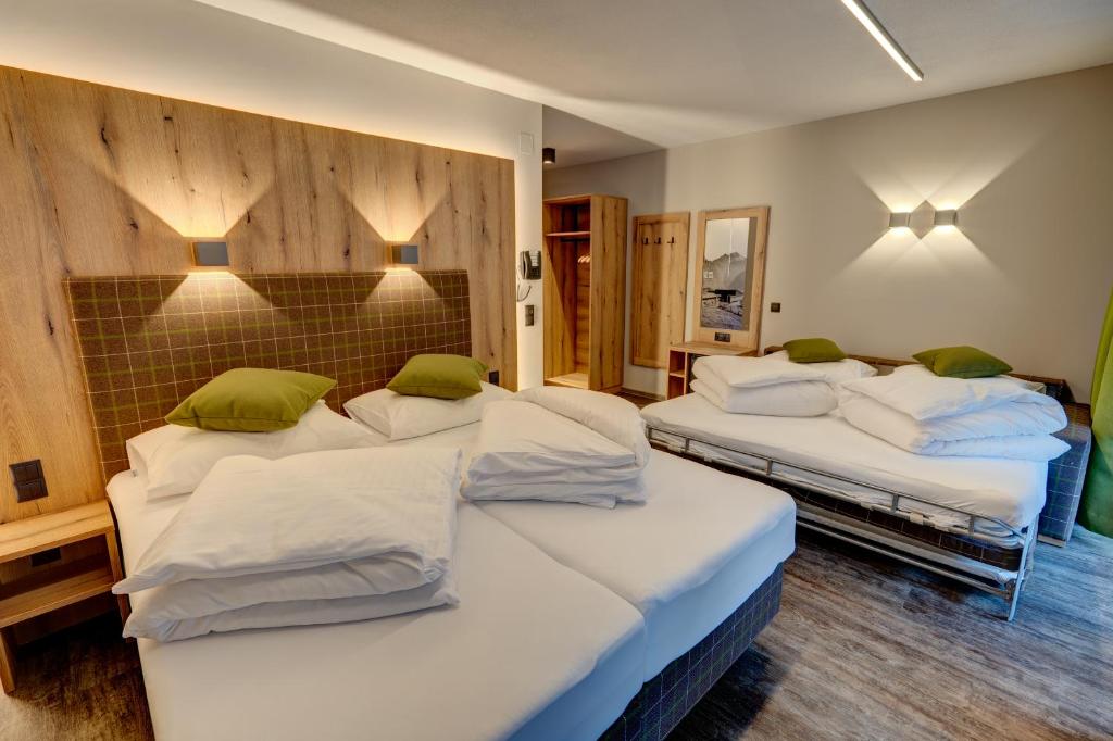 Postel nebo postele na pokoji v ubytování Der Siegeler B&B - this lifestylehotel rocks