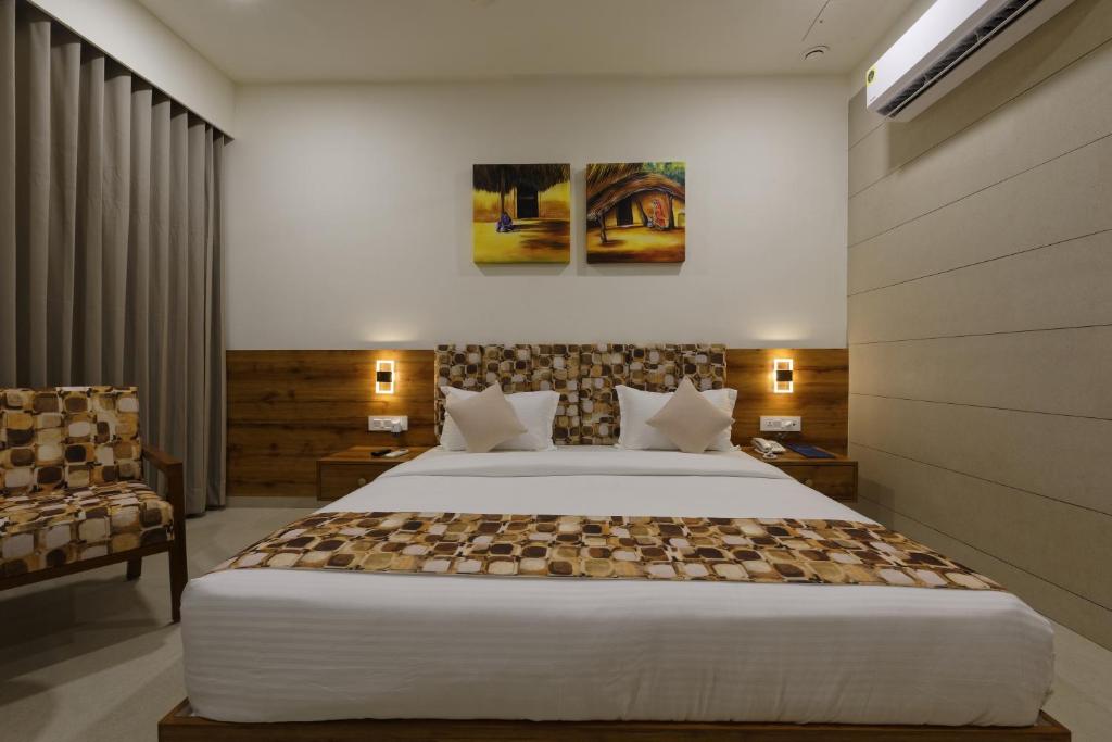 Postel nebo postele na pokoji v ubytování HOTEL FLOURISH INTERNATIONAL