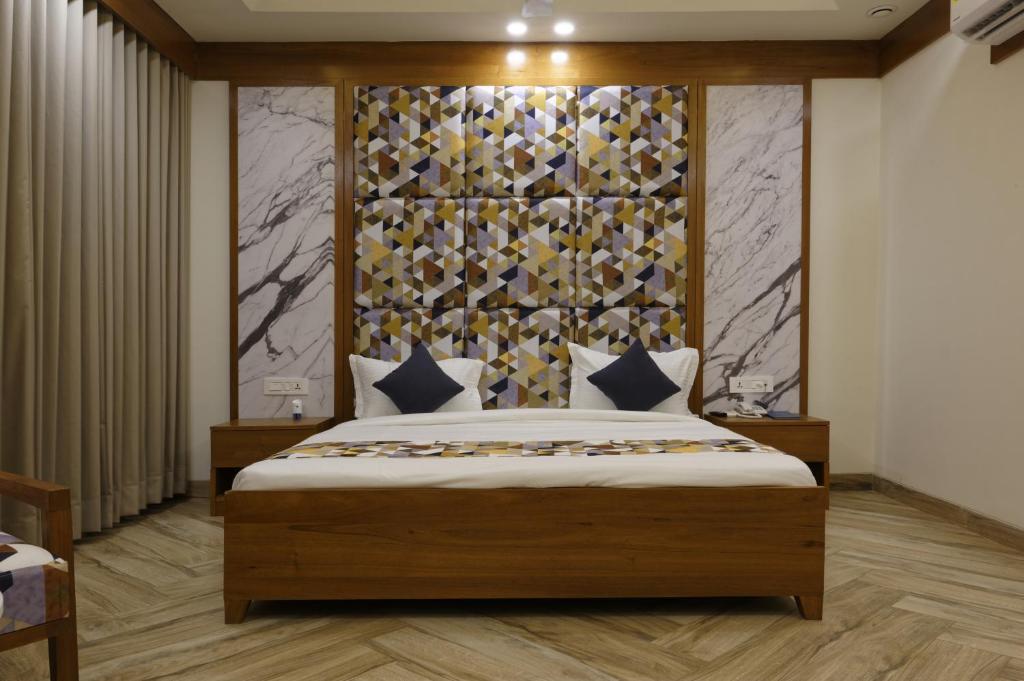 Postel nebo postele na pokoji v ubytování HOTEL FLOURISH INTERNATIONAL
