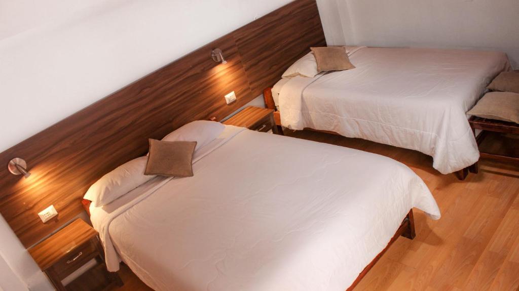 Postel nebo postele na pokoji v ubytování SAN BLAS PLAZA INn