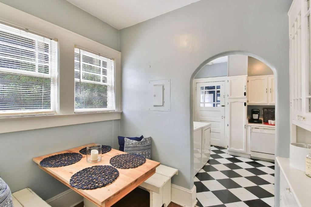 a kitchen with a table and a checkered floor at 1266 Monroe Drive 1 in Atlanta