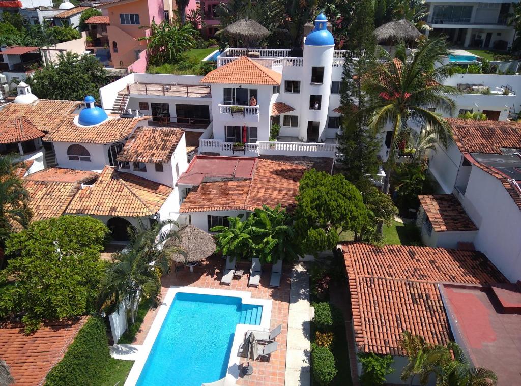 an aerial view of a resort with a swimming pool at Aventura Pacifico Boutique Hotel in Bucerías