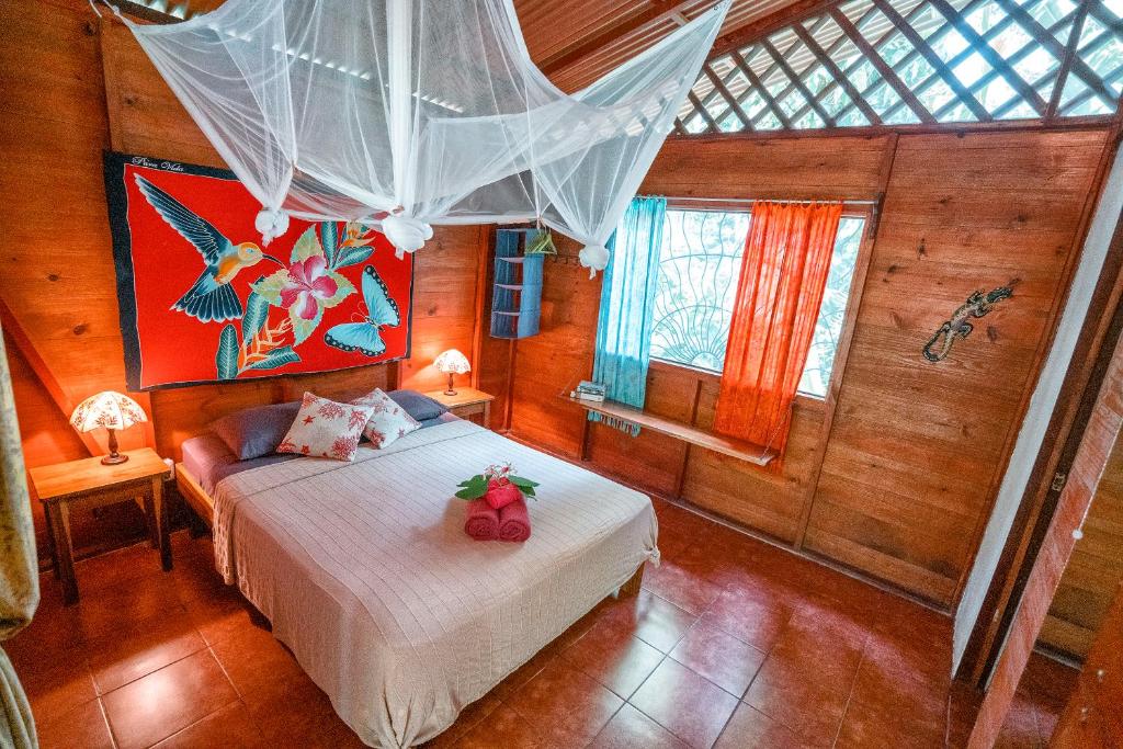 Postel nebo postele na pokoji v ubytování Casitas Las Flores