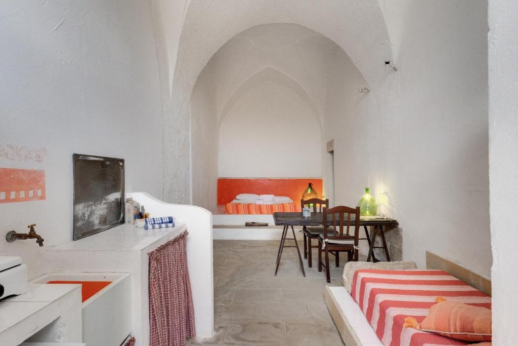 Postel nebo postele na pokoji v ubytování Masseria Tornesella Don Giuliano