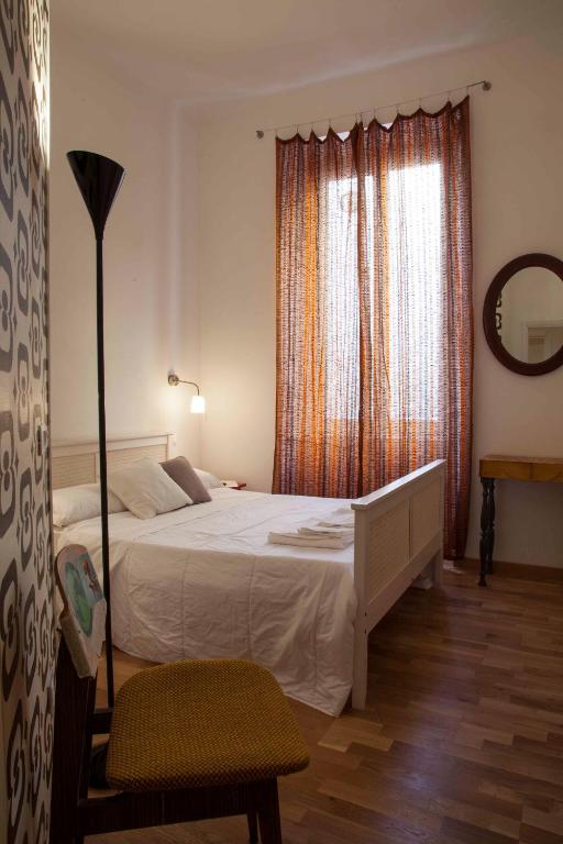 A bed or beds in a room at Albergo delle Spezie