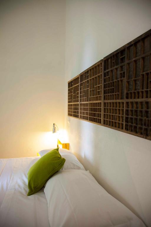 A bed or beds in a room at Albergo delle Spezie