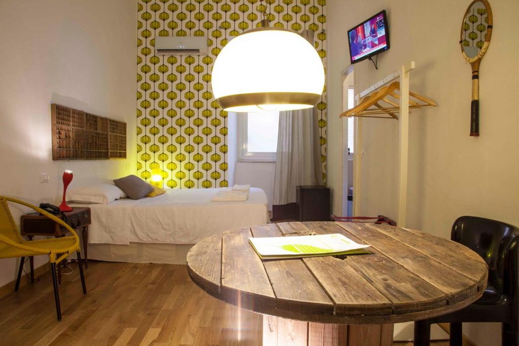 A bed or beds in a room at Albergo delle Spezie
