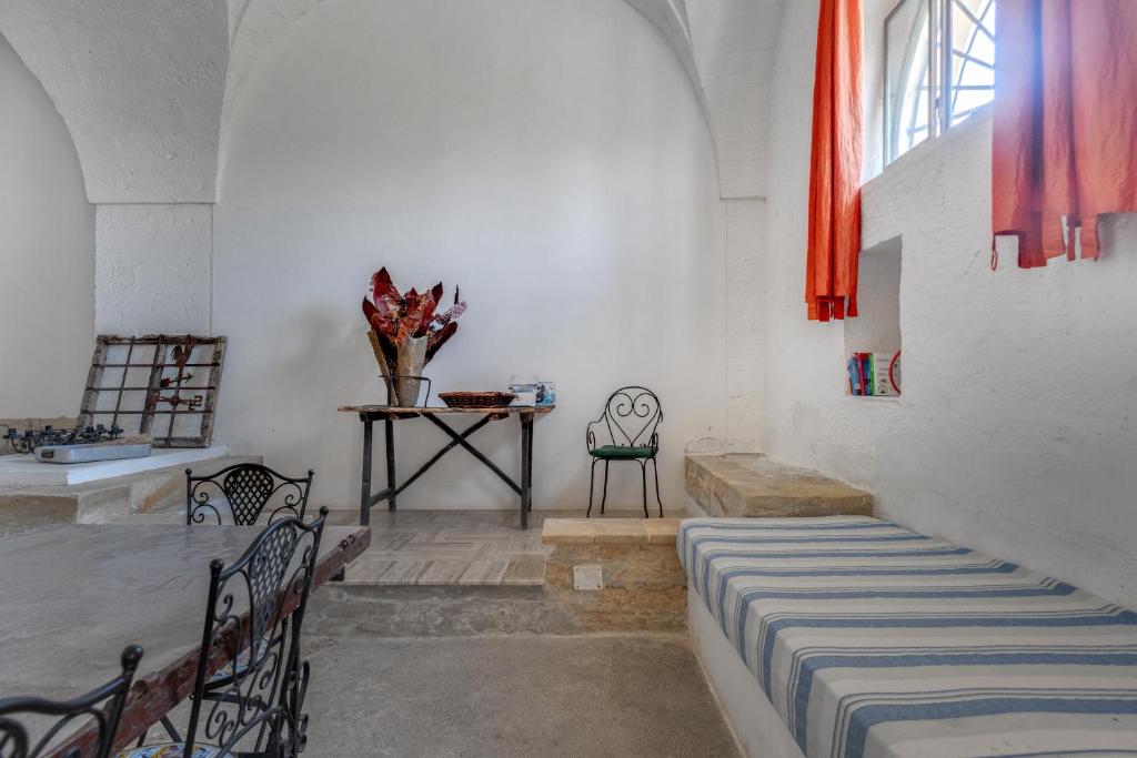 Postel nebo postele na pokoji v ubytování Masseria Tornesella Don Giuliano