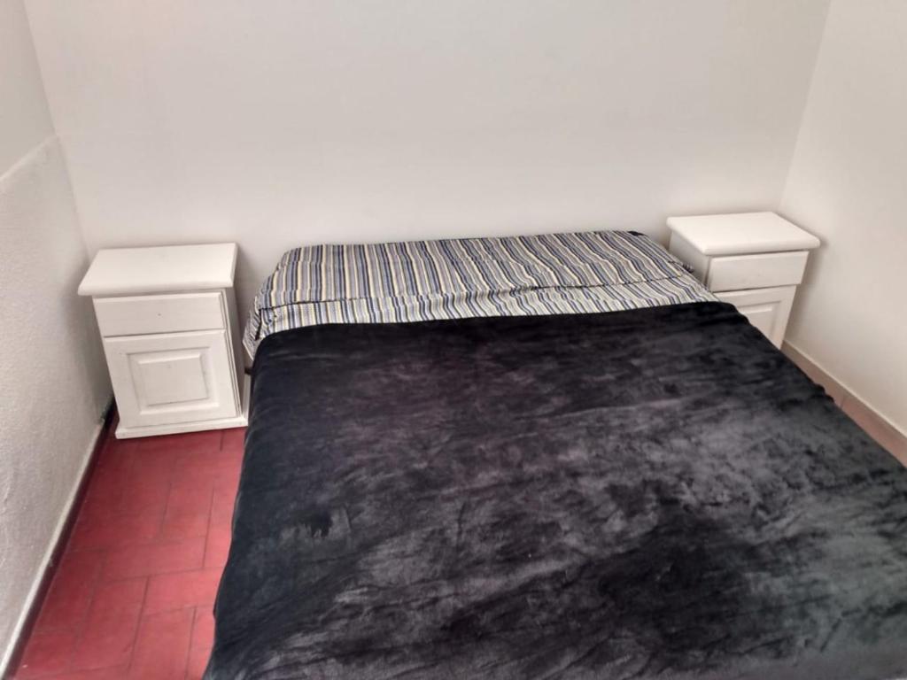 Кровать или кровати в номере Hostal Carlos