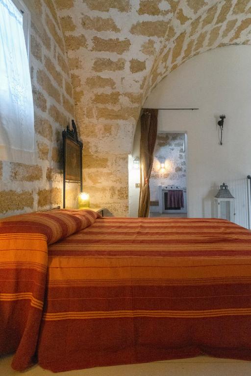 Postel nebo postele na pokoji v ubytování Masseria Tornesella Don Giuliano