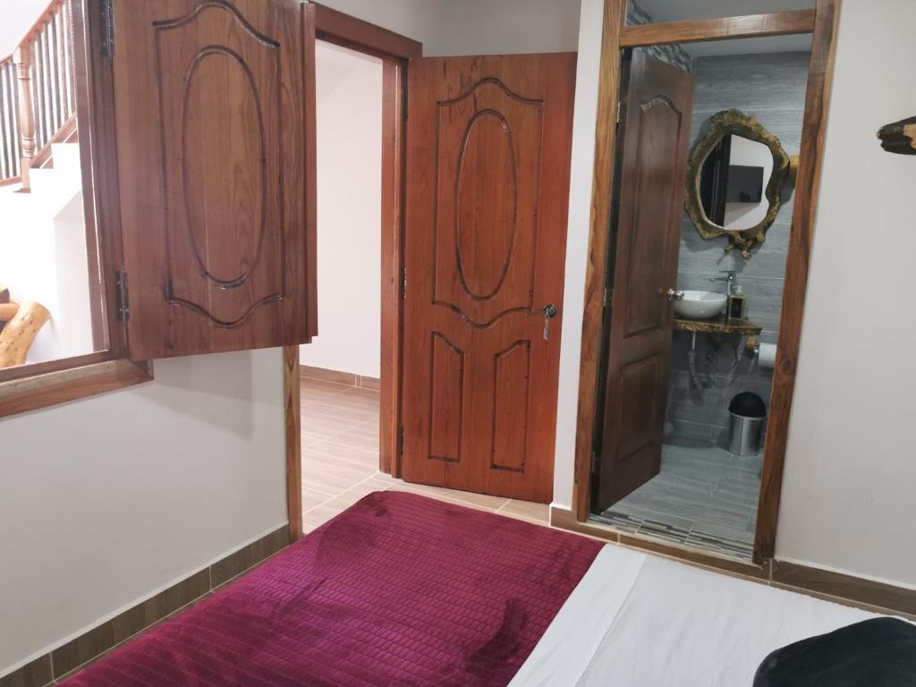 Postel nebo postele na pokoji v ubytování Hospedaje Vista Hermosa Salento