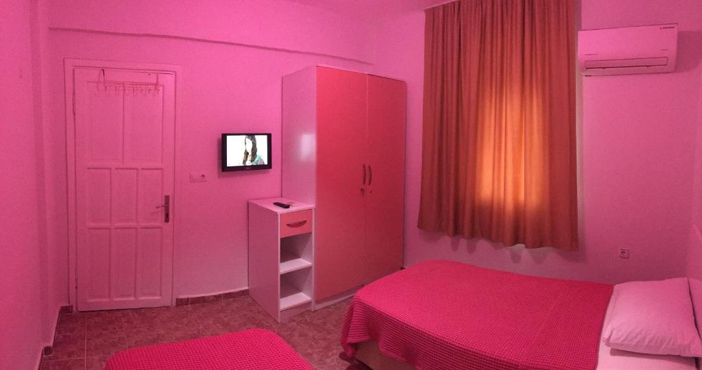Postel nebo postele na pokoji v ubytování Şato Apart Hotel