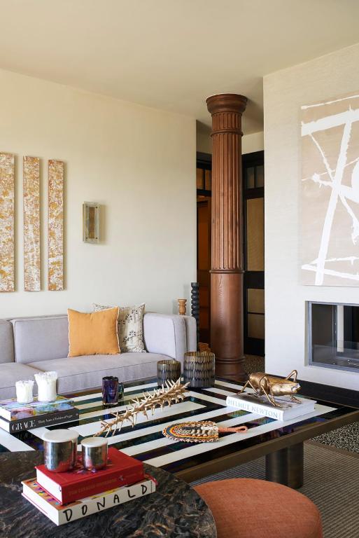 a living room with a couch and a coffee table at Root Redrock Yalıkavak in Yalıkavak