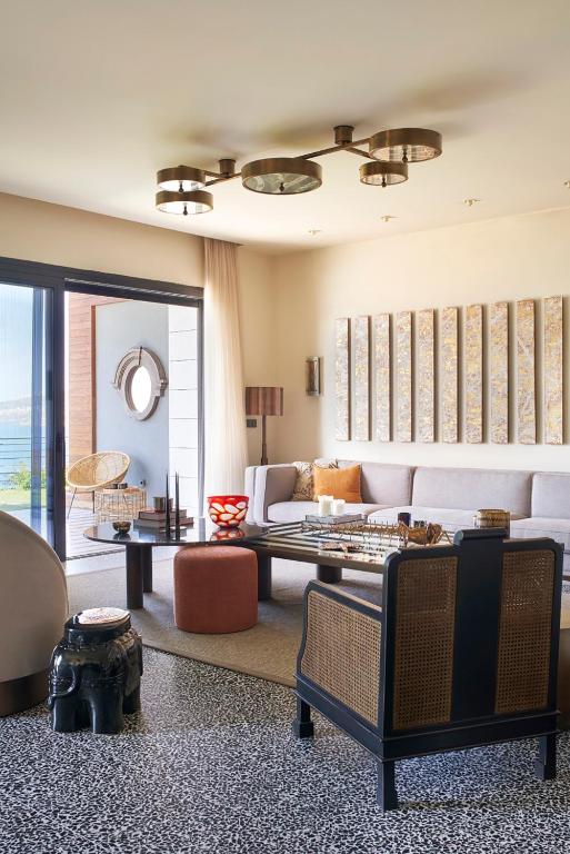 a living room with a couch and a table at Root Redrock Yalıkavak in Yalıkavak