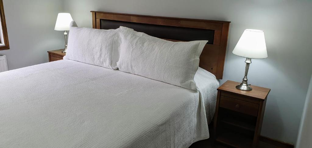 Postel nebo postele na pokoji v ubytování Hotel y Cabañas Molino Viejo