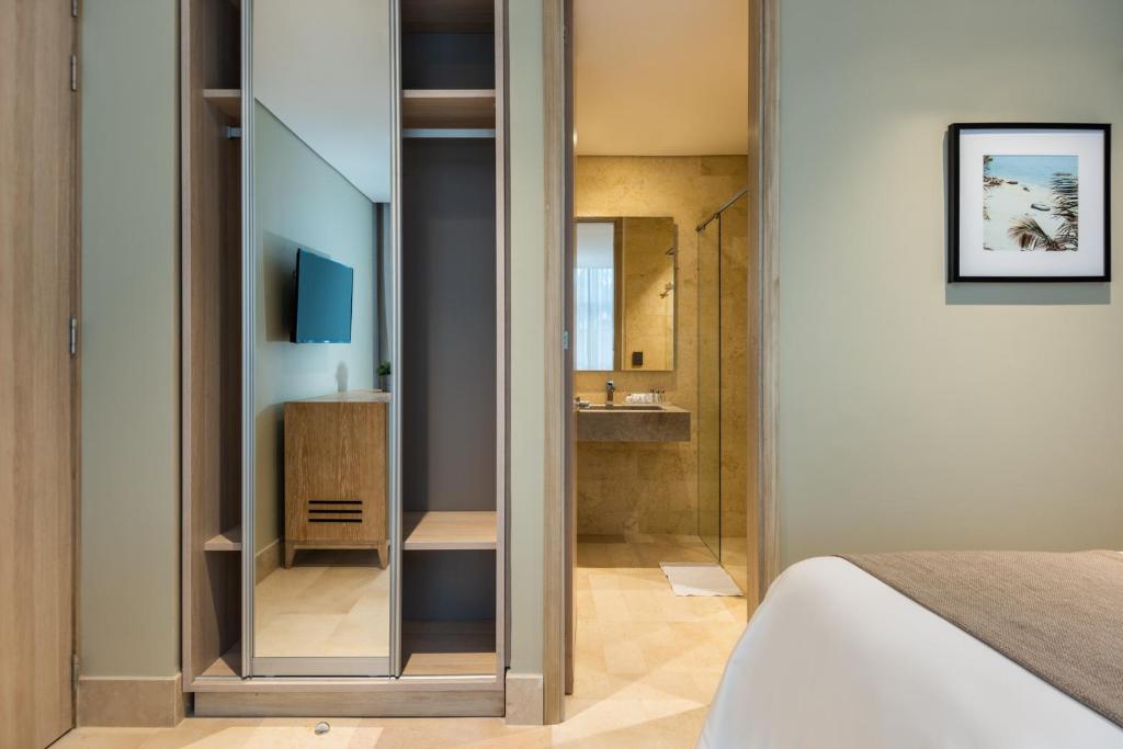 Postel nebo postele na pokoji v ubytování Oz Hotel Luxury