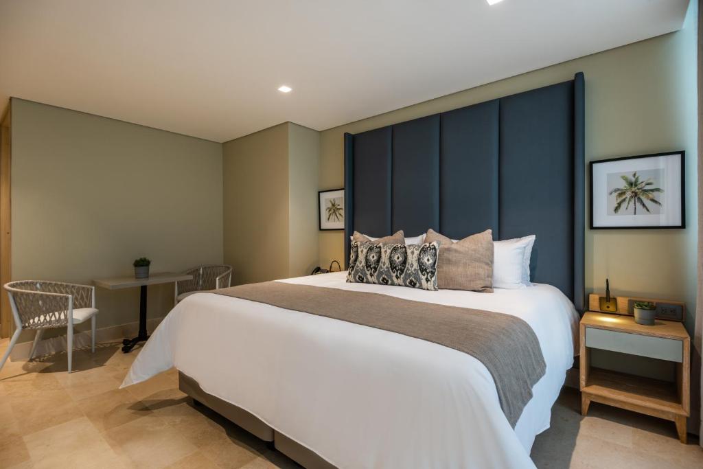 Postel nebo postele na pokoji v ubytování Oz Hotel Luxury