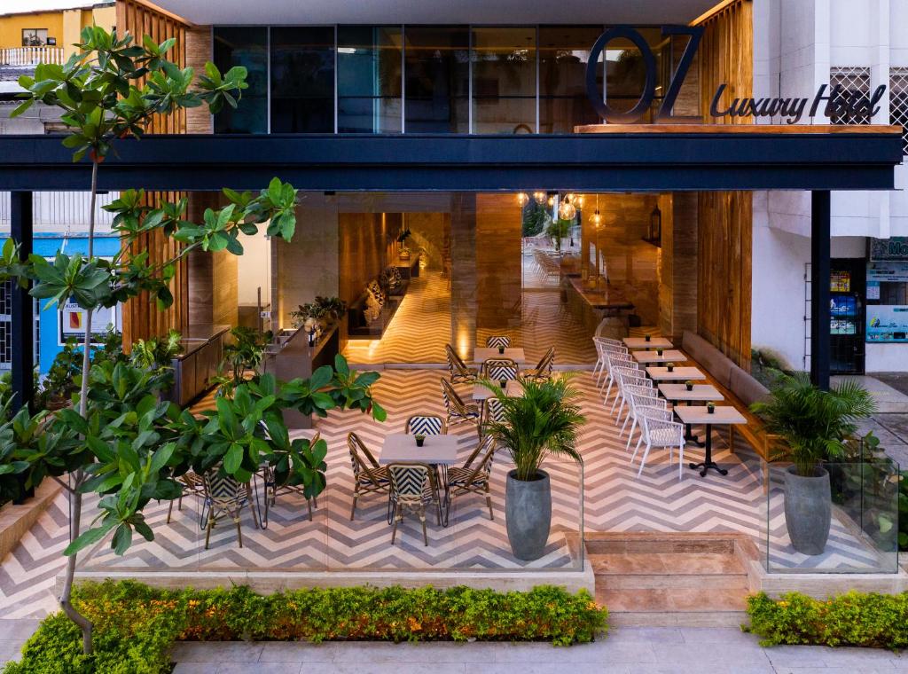 a view of a restaurant with tables and chairs at Oz Hotel Luxury in Cartagena de Indias