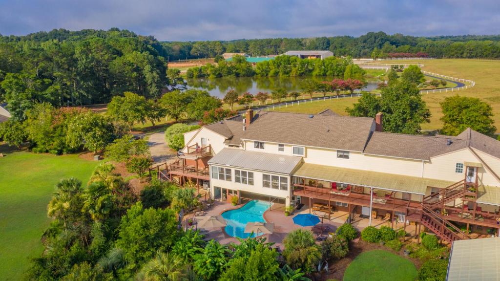 an aerial view of a large house with a large backyard at Southern Cross Guest Ranch in Madison