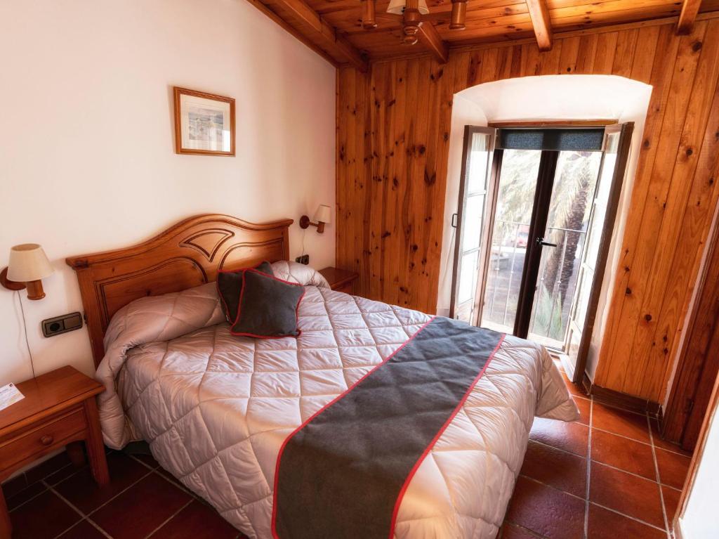Cama o camas de una habitación en Hotel Las Palmeras by Vivere Stays