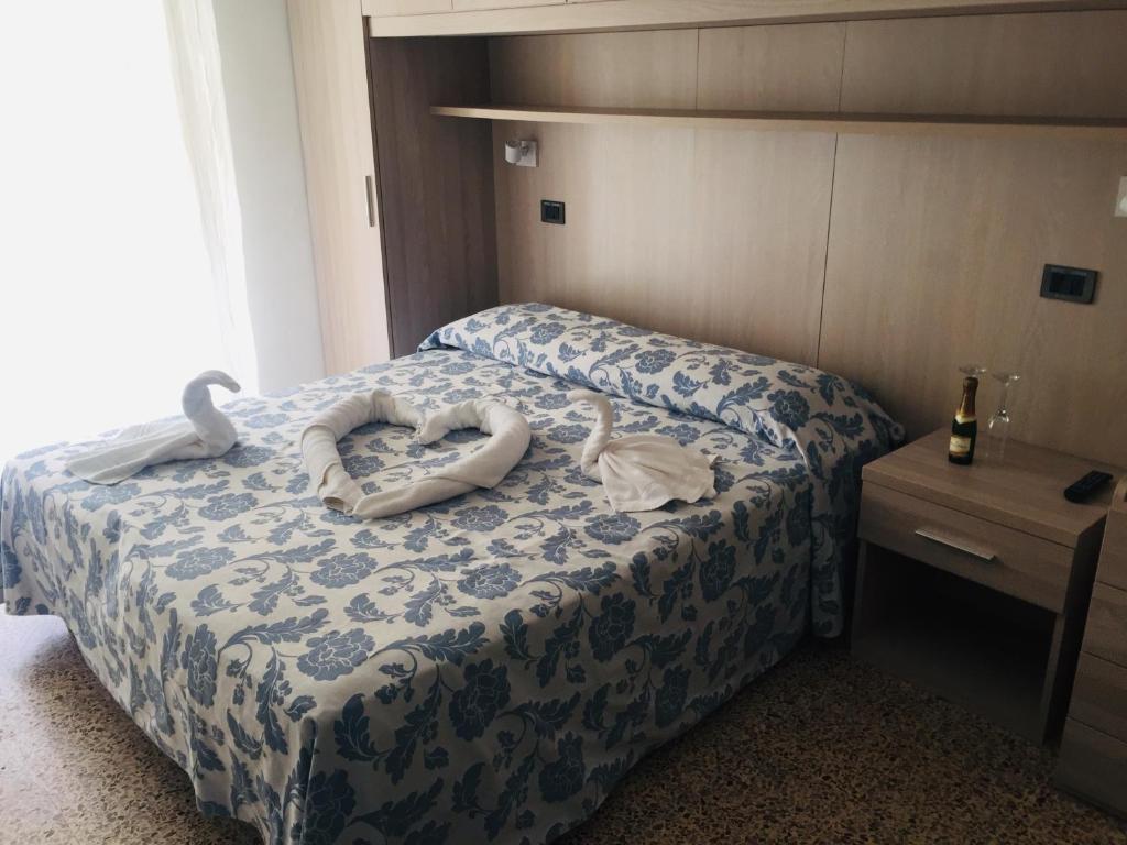 Postel nebo postele na pokoji v ubytování Hotel Zurigo