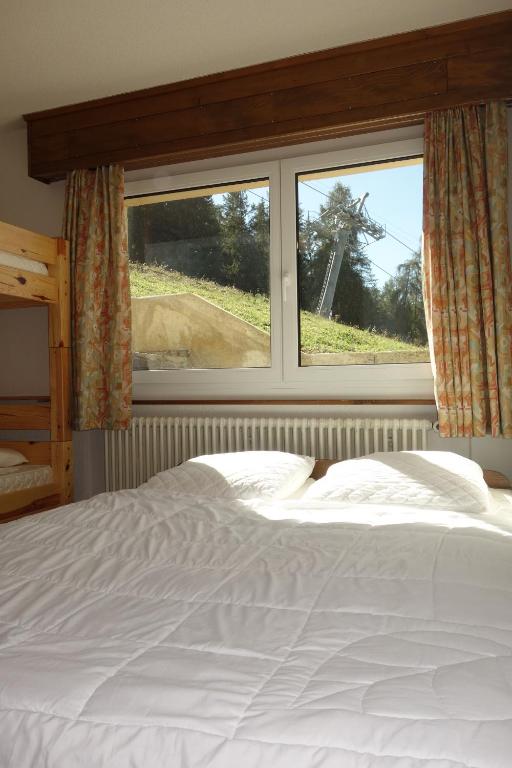 Postel nebo postele na pokoji v ubytování Magrappé MOUNTAIN & CENTER apartments