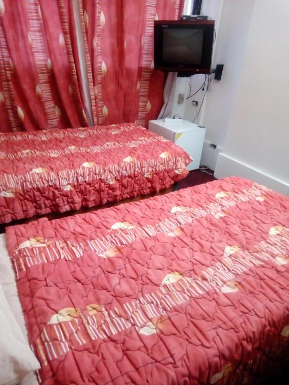 Postel nebo postele na pokoji v ubytování Arabesque Hotel