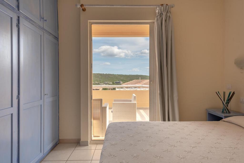 Ein Bett oder Betten in einem Zimmer der Unterkunft Baia de Bahas Residence